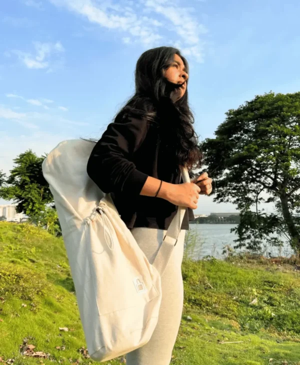 "Adjustable strap bottle holder for hands-free water carrying"