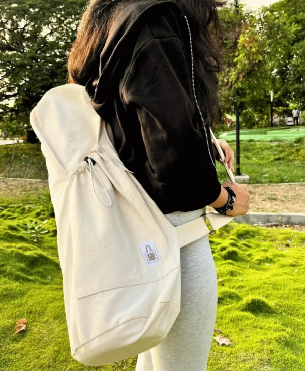 Adjustable strap bottle holder for hands-free water carrying